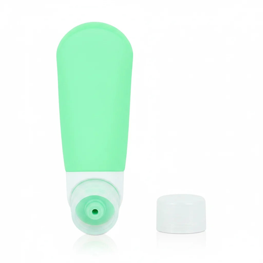 imgi_12_Mint_green_silicone_travel_bottle_with_bottom_cap_removed_showing_wide_mouth_opening_for_easy_refilling_on_white_backgrou
