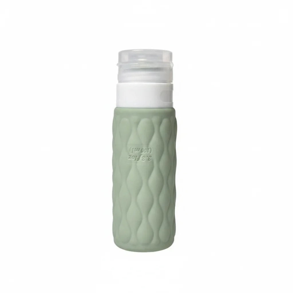 imgi_9_Sage_green_diamond_textured_silicone_travel_cosmetic_bottle_with_white_pump_cap_upright_on_pure_white_background_mai